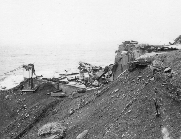 Photo of the remains of Scotch Cap Lighthouse taken from the bluff after the 1946 tsunami. (U.S. Coast Guard)