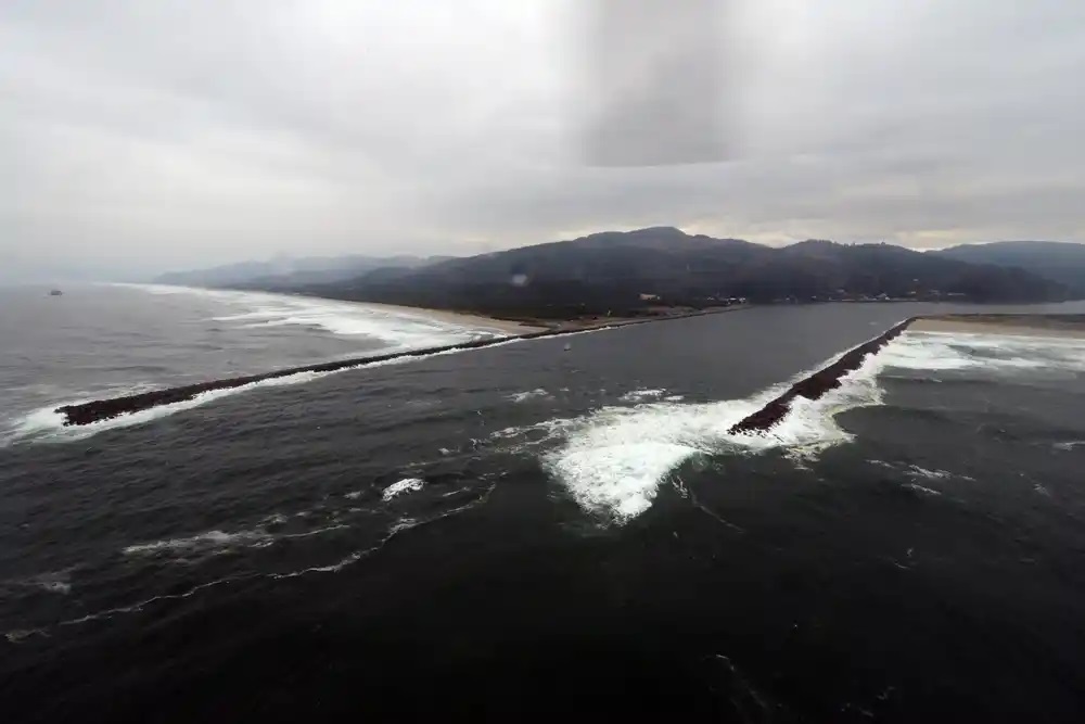 . The jetties and dangerous approaches to the Tillamook Bay Bar, Oregon where Petty Officer 1st Class Richard Dixon performed his two Coast Guard Medal rescues, the weekend of July 4th, 1980. (U.S. Coast Guard)