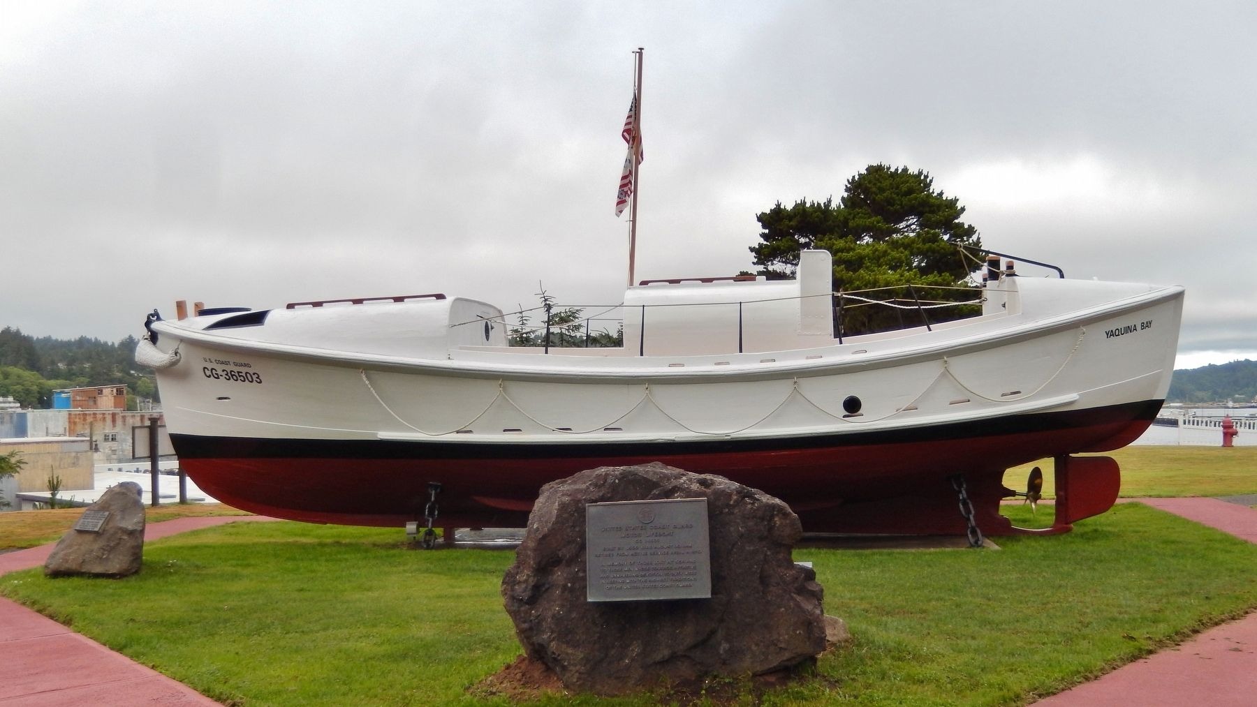 The lifesaving marker and 36-foot motor lifeboat on display at Coast Guard Station Yaquina Bay, Newport, Oregon (Historical Marker Database)