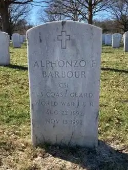Color photo of Commissary Steward First Class Alphonzo F. Barbour’s headstone located at Arlington National Cemetery, where he was laid to rest in 1992. (Courtesy of Bradley Custer and Findagrave.com)