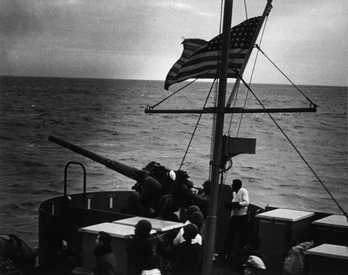 Rare photograph showing the 11-man gun crew for Campbell’s gun Number 3 during daylight action. Etheridge served as gun captain for this 3-inch battery that shelled German submarine U-606. (U.S. Coast Guard)