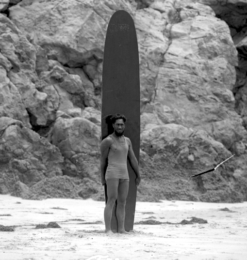 A 1920 photograph of Duke Kahanamoku with his long board, who served in the Coast Guard Temporary Reserves during World War II. (Wikipedia)