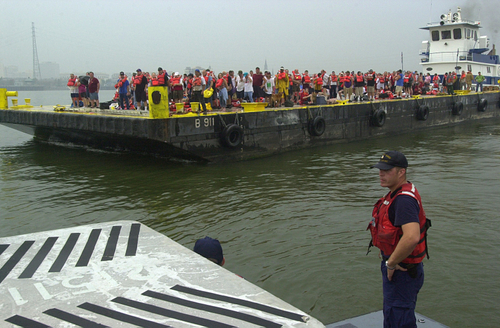 6.	Cuttermen on board a Coast Guard boat keep a watchful eye over evacuation operations. (U.S. Coast Guard)