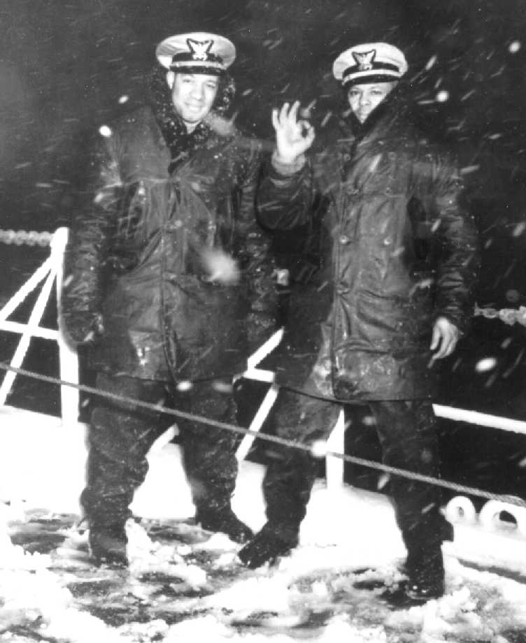 Lt.j.g. Clarence Samuels and another black officer stand on deck during a winter patrol of the Sea Cloud. (U.S. Coast Guard Collection)