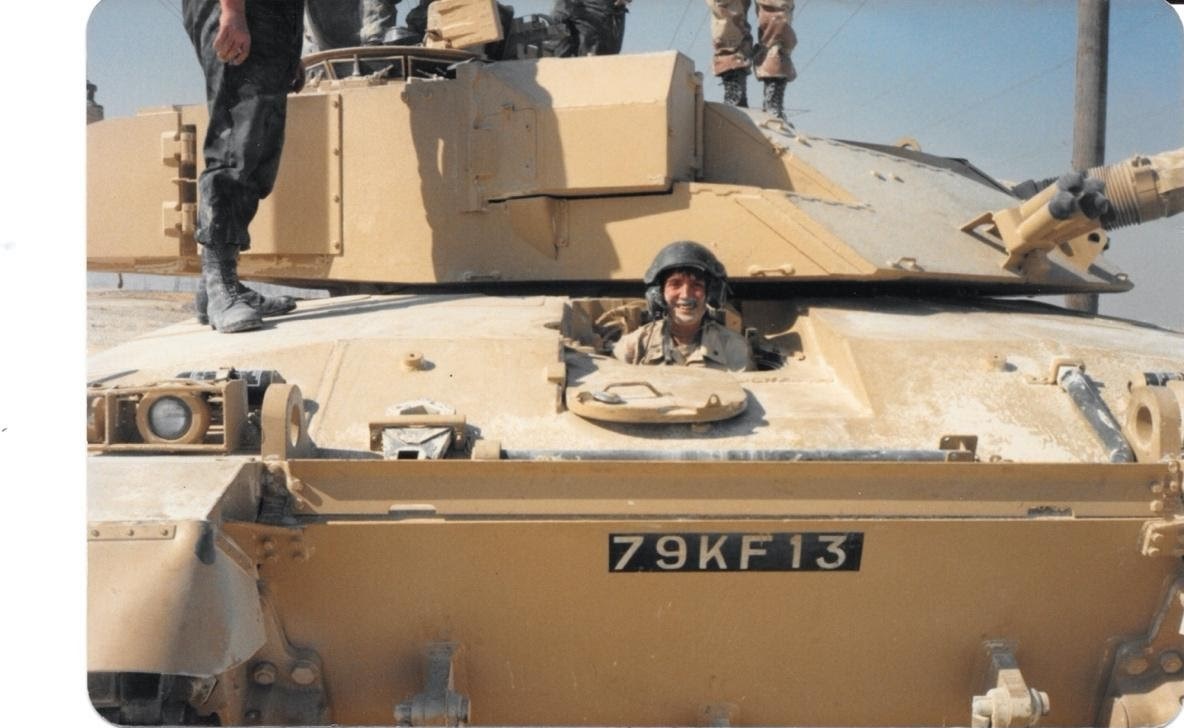 Lt. Cmdr. Carol Rivers sitting in the driver’s seat of a British “Challenger” battle tank. (Courtesy of Lt. Cmdr. Carol Rivers)