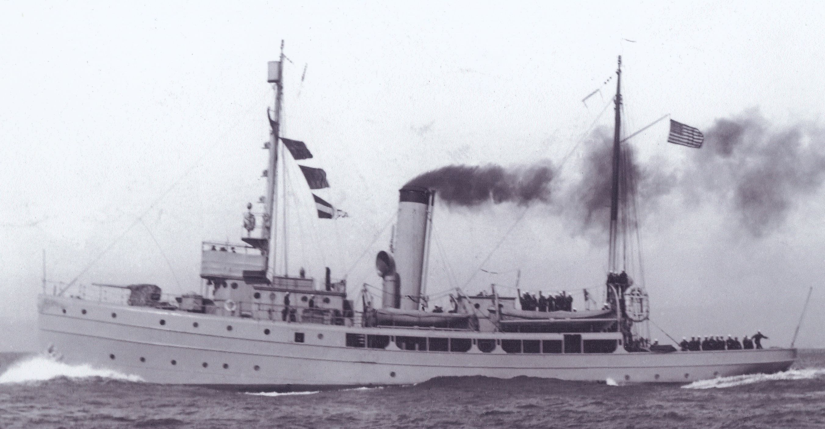 World War I photograph of Snohomish under full head of steam with 3-inch deck gun, added flying bridge and haze gray paint scheme. (Courtesy of NOAA)