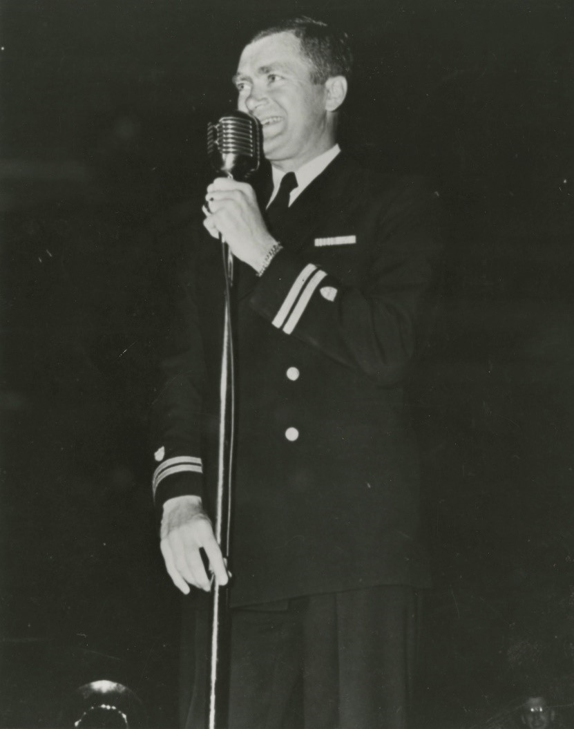 7.	Lt. Buddy Ebsen on stage hosting the 7th War Loan bond drive in Seattle. (U.S. Coast Guard)