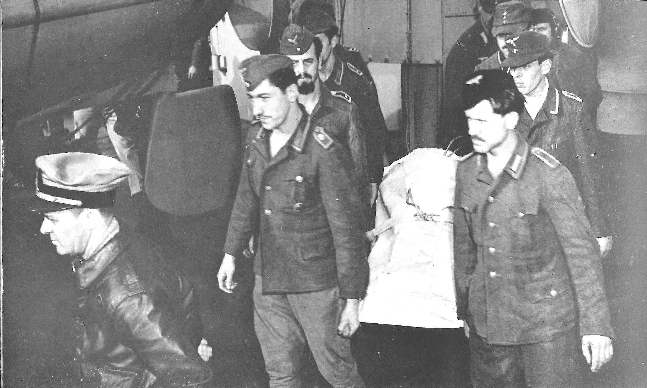 On board the Boston-bound Wakefield, German POWs bury at sea one of their deceased comrades. (U.S. Coast Guard)