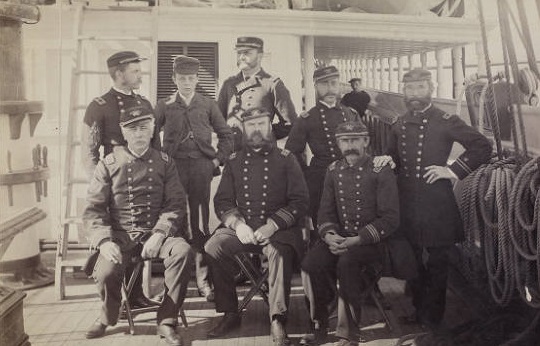 Photograph of Captain Hooper and his officers during the 1886 cruise of Revenue Cutter Richard Rush with Michael Healy’s son Fred, who served as cabin boy, in the back row. (Digital Collections of the Huntington Library)