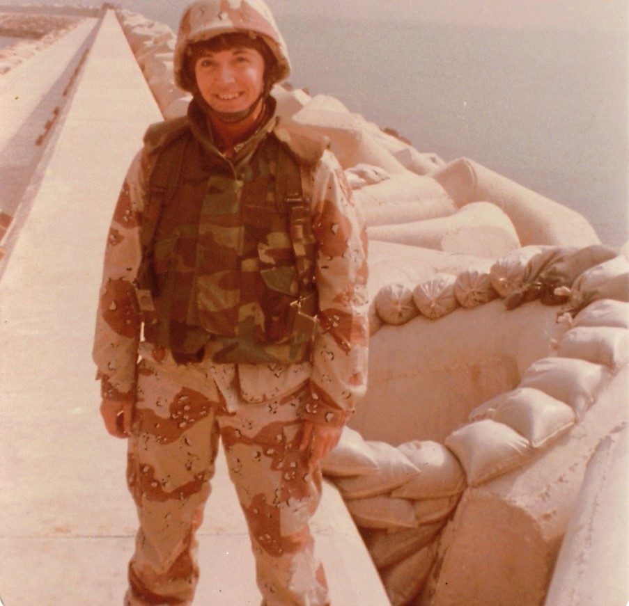 Lt. Cmdr. Carol Rivers in desert camo uniform on the breakwater at the port of Al Jubail on the western coast of Saudi Arabia. (Courtesy of Lt. Cmdr. Carol Rivers)