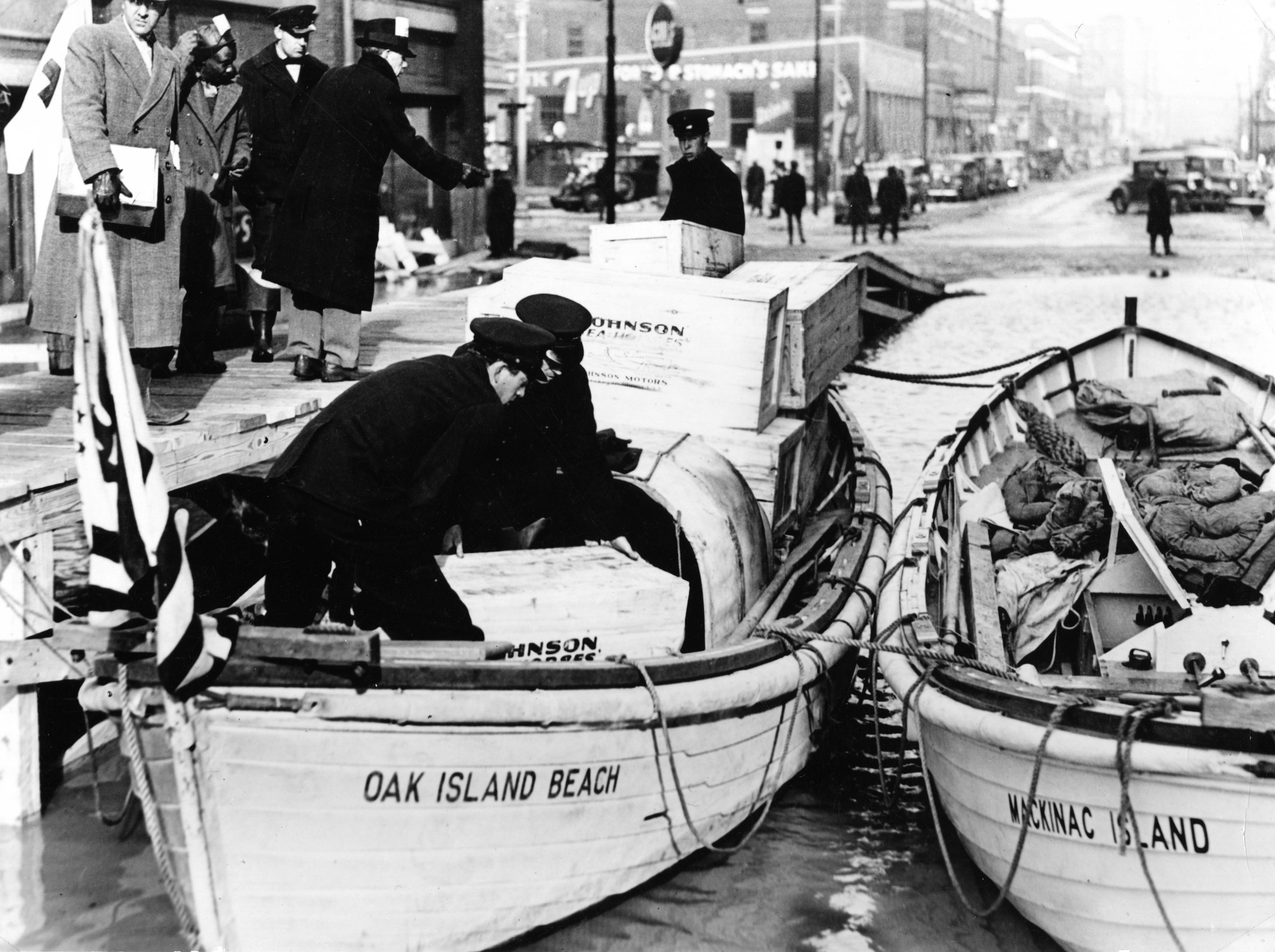 For the Ohio River flood relief effort, the Coast Guard mobilized units from the entire eastern U.S., including motor lifeboats from Oak Island Beach, New York, and Mackinac Island, Michigan, shown here assisting in Evansville, Indiana. (U.S. Coast Guard)