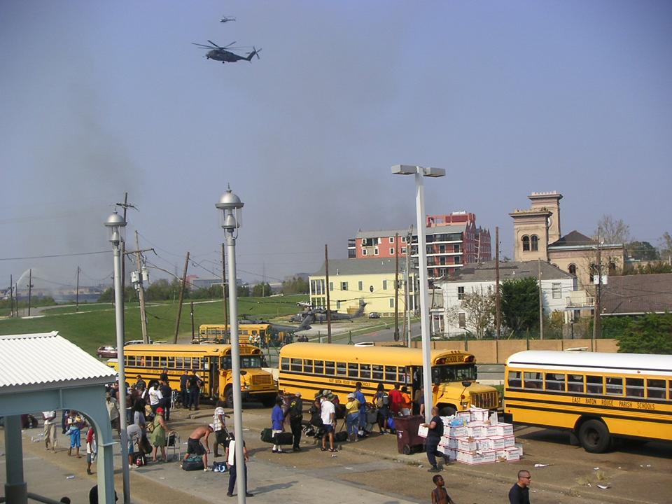 8.	School busses assemble to evacuate displaced persons near the landing zone at the Algiers Ferry Terminal. (U.S. Coast Guard)