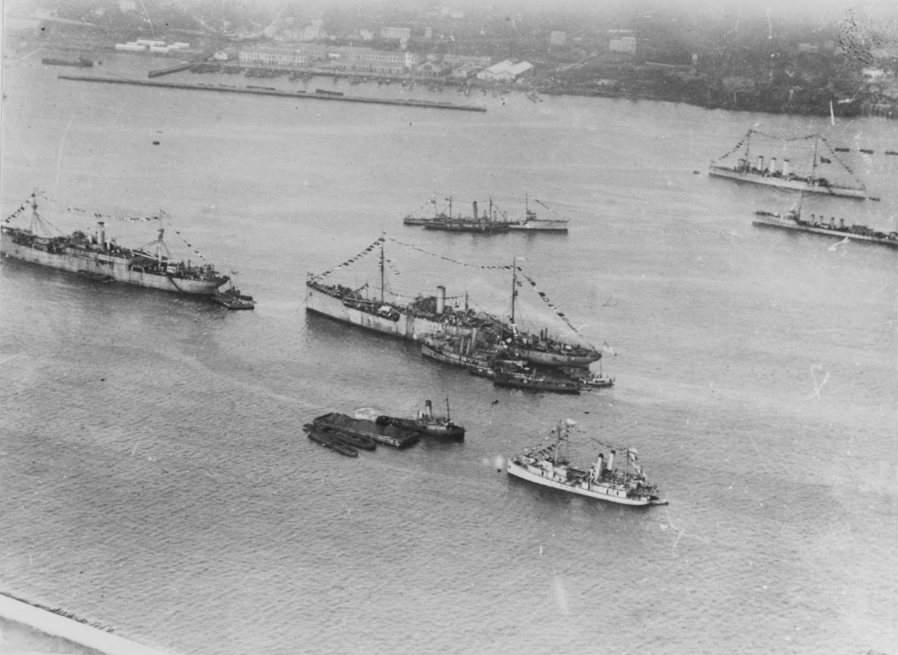 Aerial view of Brest Harbor during World War I with naval vessels at anchor, including two wooden minesweepers at bottom center (Courtesy of Naval History and Heritage Command)