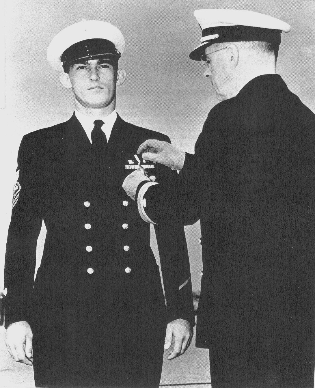 8.	Ray Evans receiving his Navy Cross Medal for action seen at Point Cruz. Evans had already received a battlefield advancement to chief petty officer and later received an officer’s commission. (Coast Guard Collection)