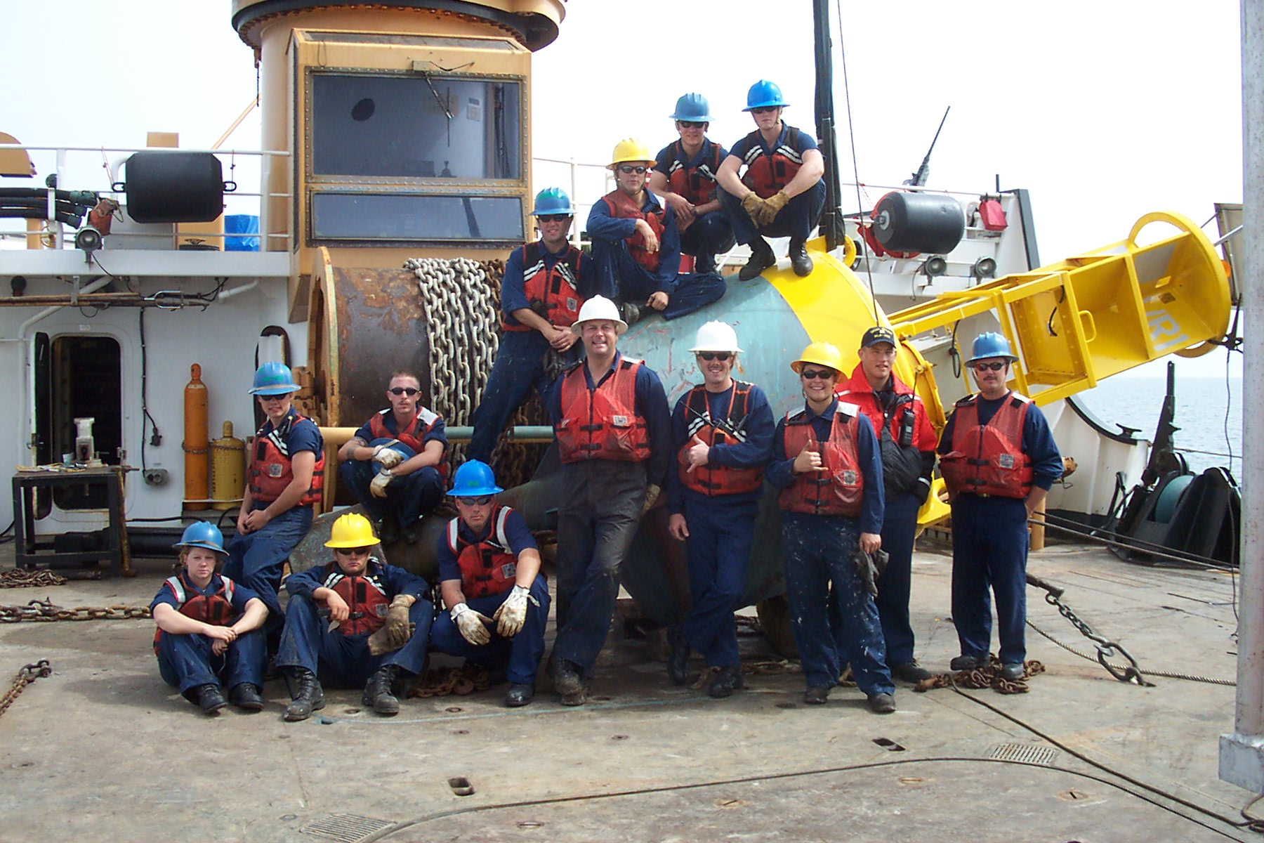 Coast Guard Cutter Walnut’s deck gang posts with a newly raised Iraqi buoy. (Coast Guard Collection)