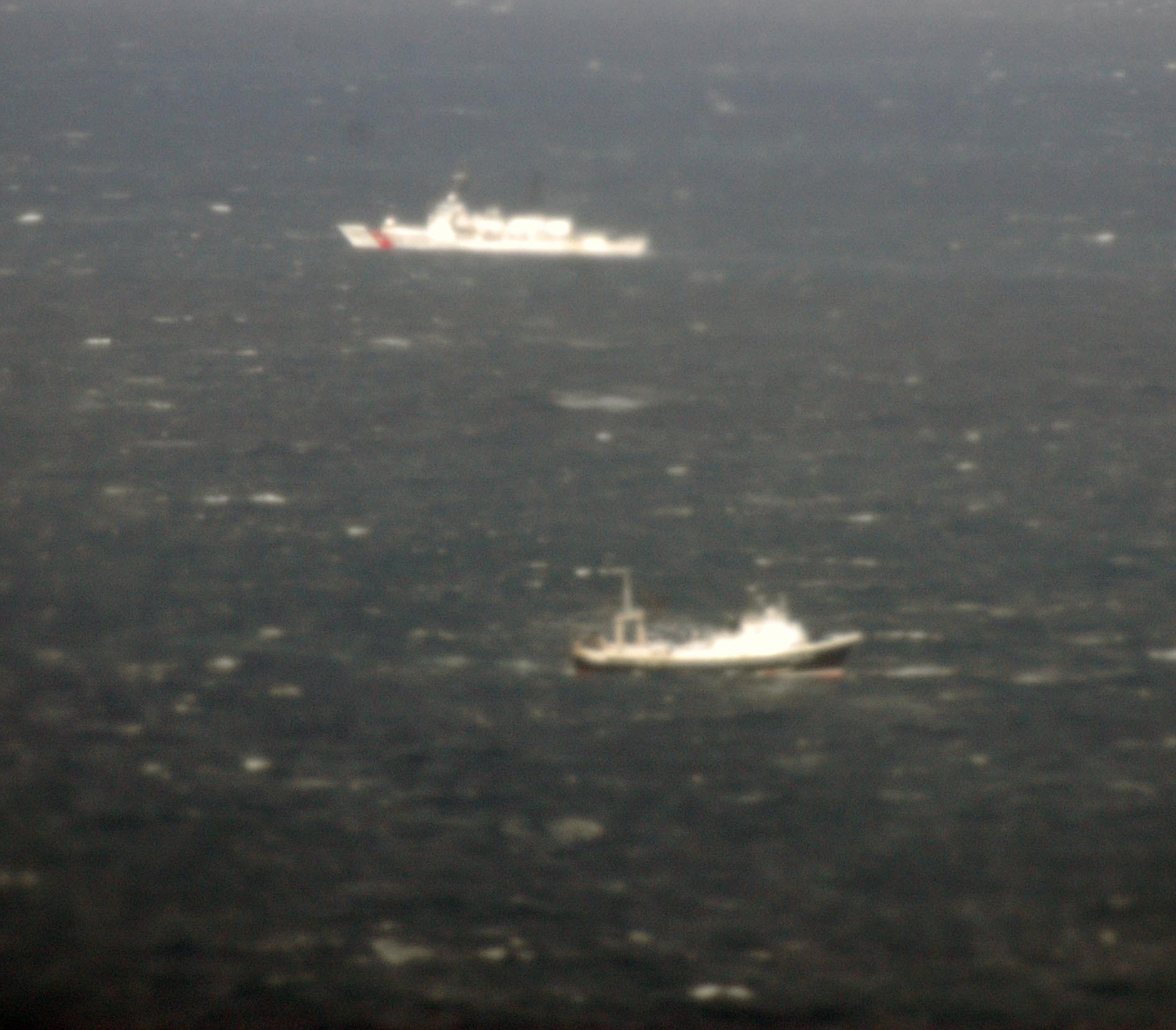 The Coast Guard Cutter Munro and a Good Samaritan vessel search for victims of Fishing Vessel Alaska Ranger. (Petty Officer 3rd Class Richard Brahm, U.S. Coast Guard)