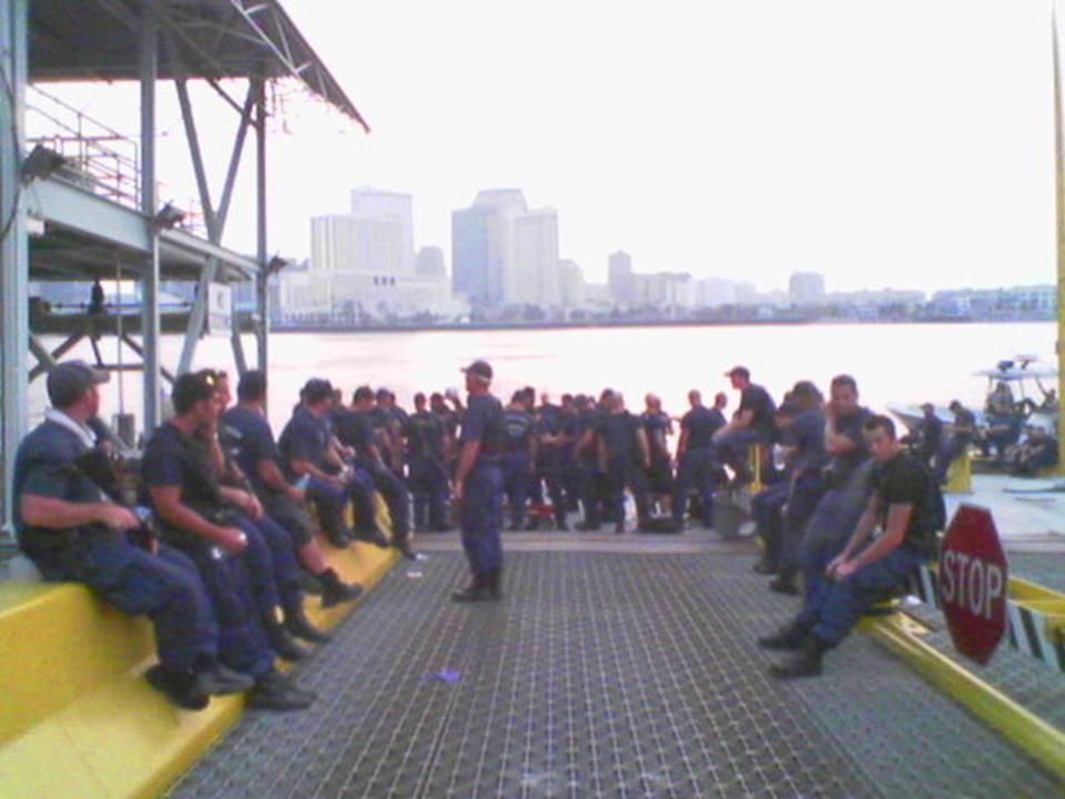 Chief Warrant Officer Lewald assembles the Coast Guard crew at the Algiers Ferry Terminal before the last night of operations for Pamlico and its flotilla. (U.S. Coast Guard)