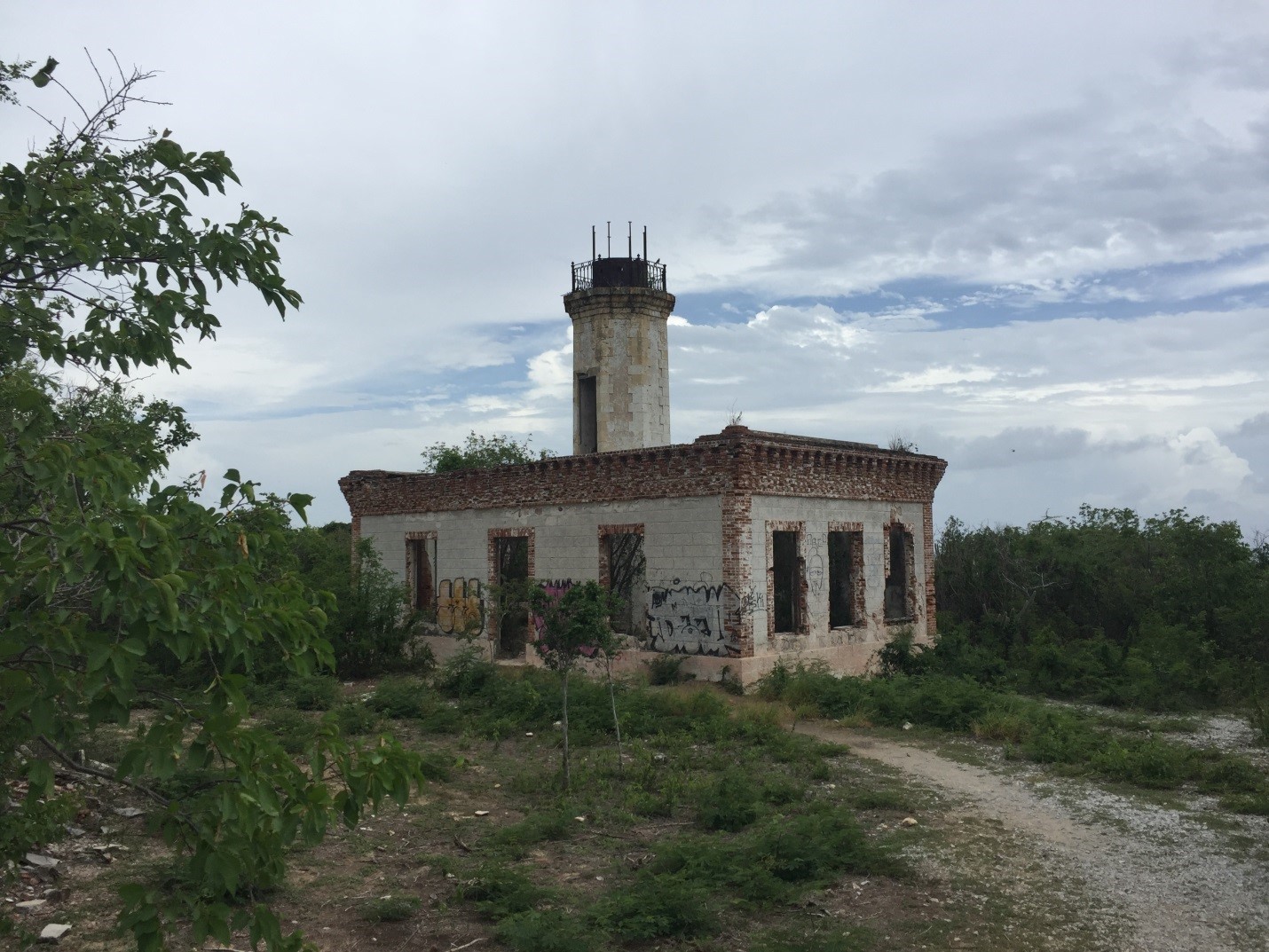 9.	View of Guanica Lighthouse from the northwest in 2016 showing damage and vandalism. (Photo taken by author)