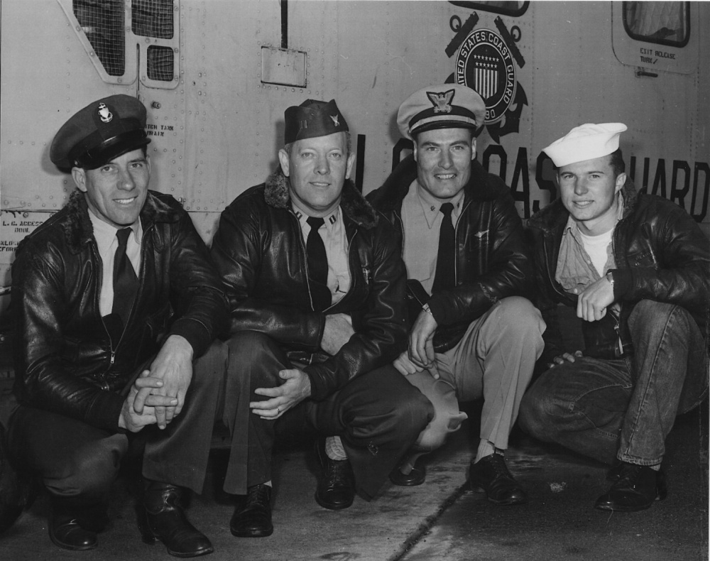A 1956 image of the heroic Coast Guard crew of the Yuba City rescue kneeling in front of their helicopter. From left to right are Chief Aviation Machinist Mate (ADC) Joseph Accamo, LT Henry Pfeiffer, LCDR George Thometz and Aviation Machinist Mate Second Class (AD2) Victor Rouland. (Coast Guard Aviation Association)