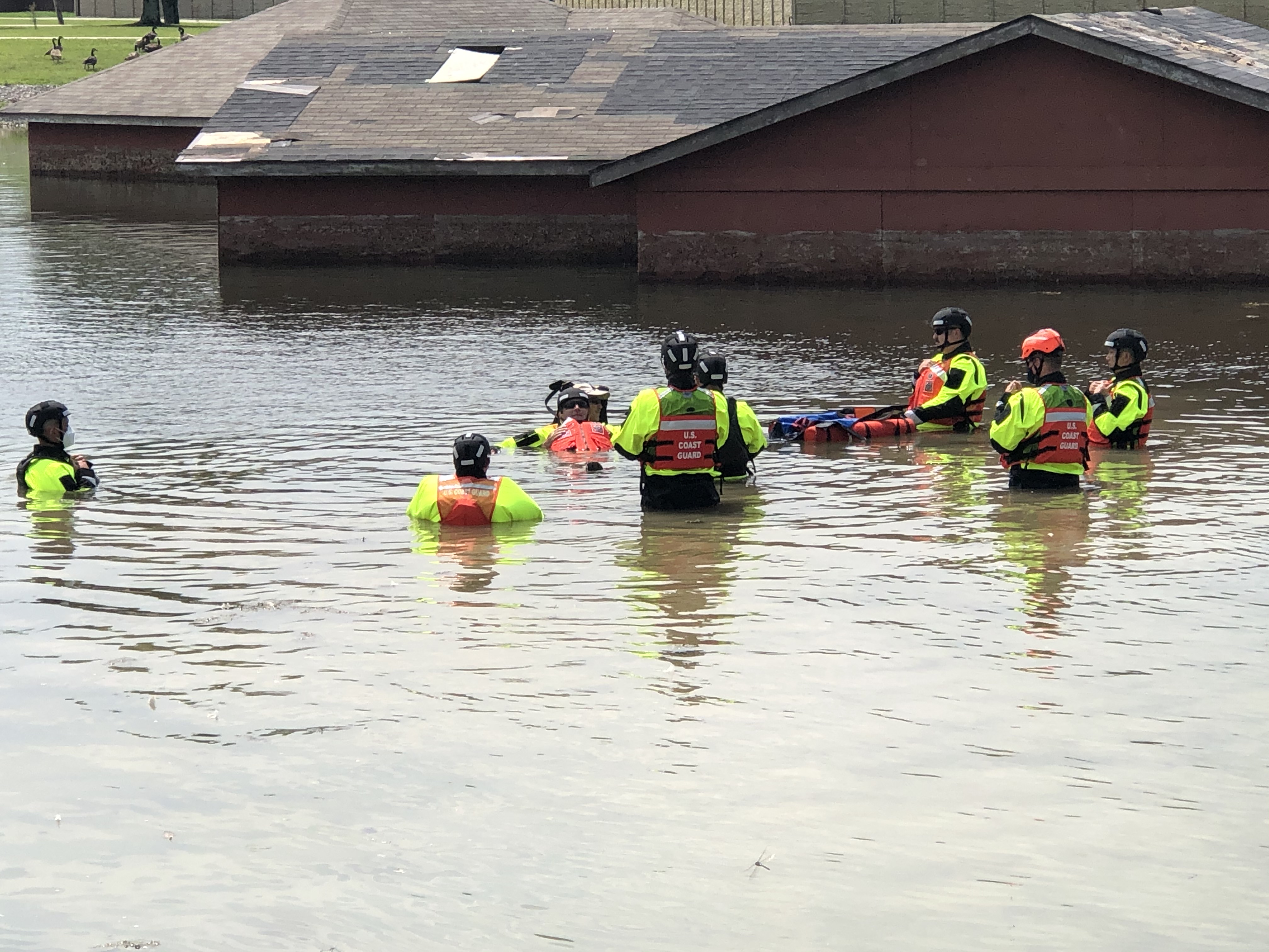 BUTLERVILLE, IN - Coast Guard members become accustomed to driving  CRRCs, or inflatable boats through deeper floodwaters during flood training at the Muscatatuck Urban Training Center (MUTC) in August 2020. During this training members have an opportunity to learn how to operate these types of boats in the case they need to respond to a flooded community. (U.S. Coast Guard photo.)