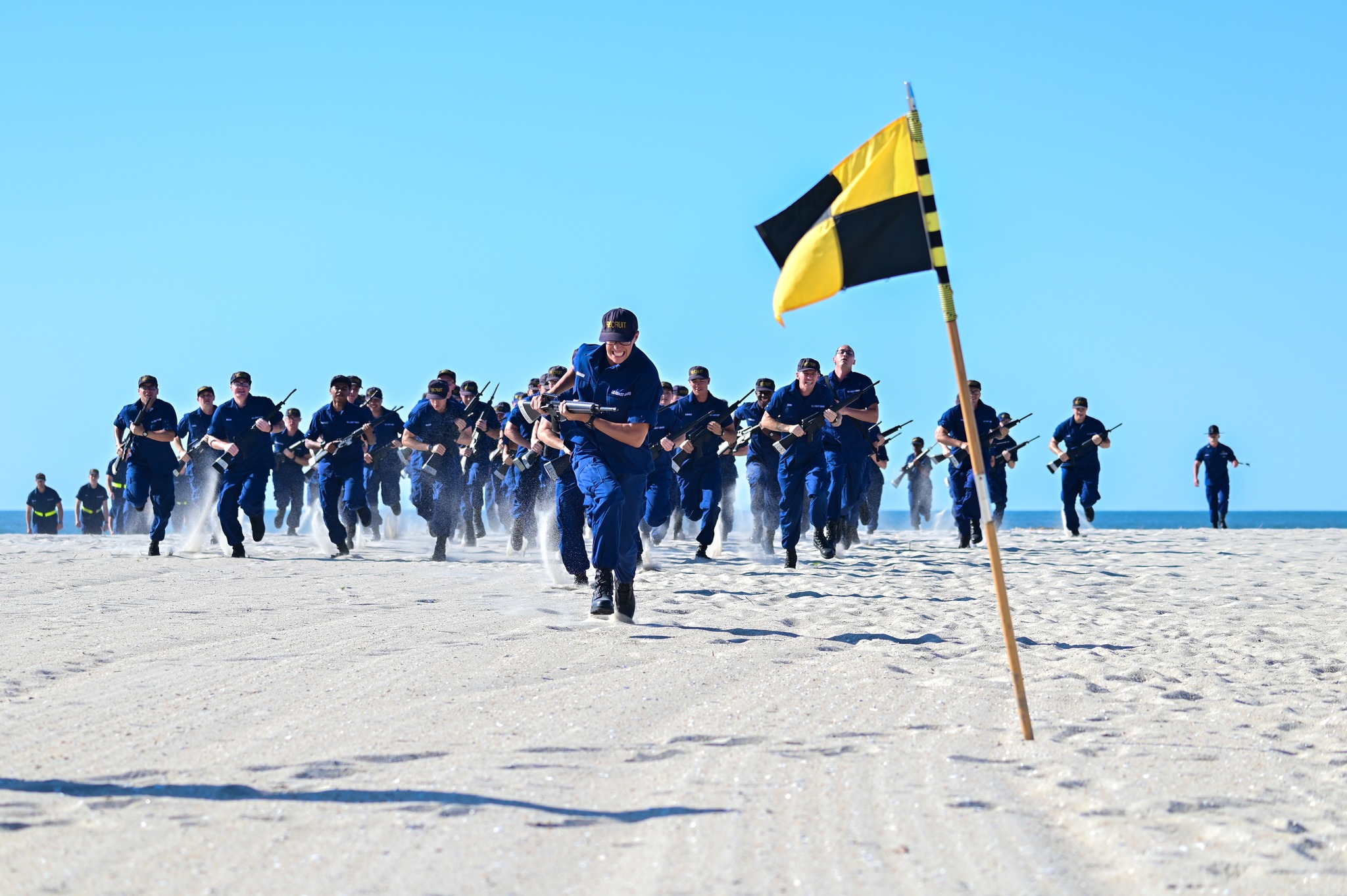 Recruits with Lima-205 earn their colors on the beach on June 8, 2024 at U.S. Coast Guard Training Center Cape May, New Jersey. A company earning their colors is a significant milestone in recruit training and marks camaraderie and seniority on the regiment. (U.S. Coast Guard photo by Petty Officer 2nd Class Gregory Schell) Recruits with Lima-205 earn their colors on the beach on June 8, 2024 at U.S. Coast Guard Training Center Cape May, New Jersey. A company earning their colors is a significant milestone in recruit training and marks camaraderie and seniority on the regiment. (U.S. Coast Guard photo by Petty Officer 2nd Class Gregory Schell)
