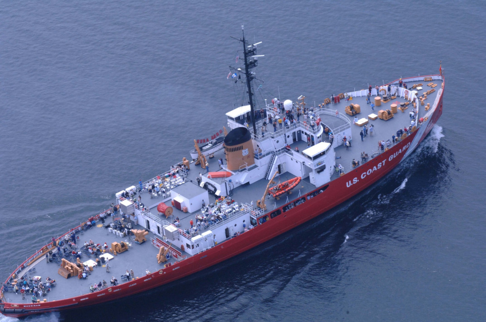 Aerial photo of Mackinaw in modern red paint scheme showing the icebreaker’s extreme width. (U.S. Coast Guard)