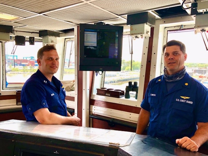 Two cuttermen aboard the Coast Guard Cutter Harriet Lane check out their new Minotaur installment aboard.