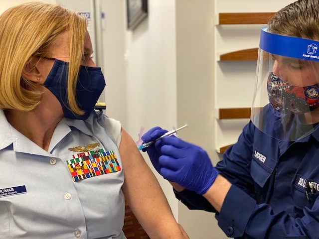 Rear Admiral Dana Thomas, the Coast Guard's chief medical officer, receives the COVID-19 vaccine at the Coast Guard Base National Capital Region clinic, Jan. 7, 2021. 