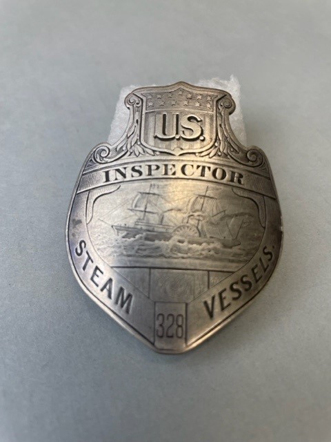 1.	Example of an original Steamboat Inspection Service badge from the Coast Guard Historic Artifact Collection. (U.S. Coast Guard)