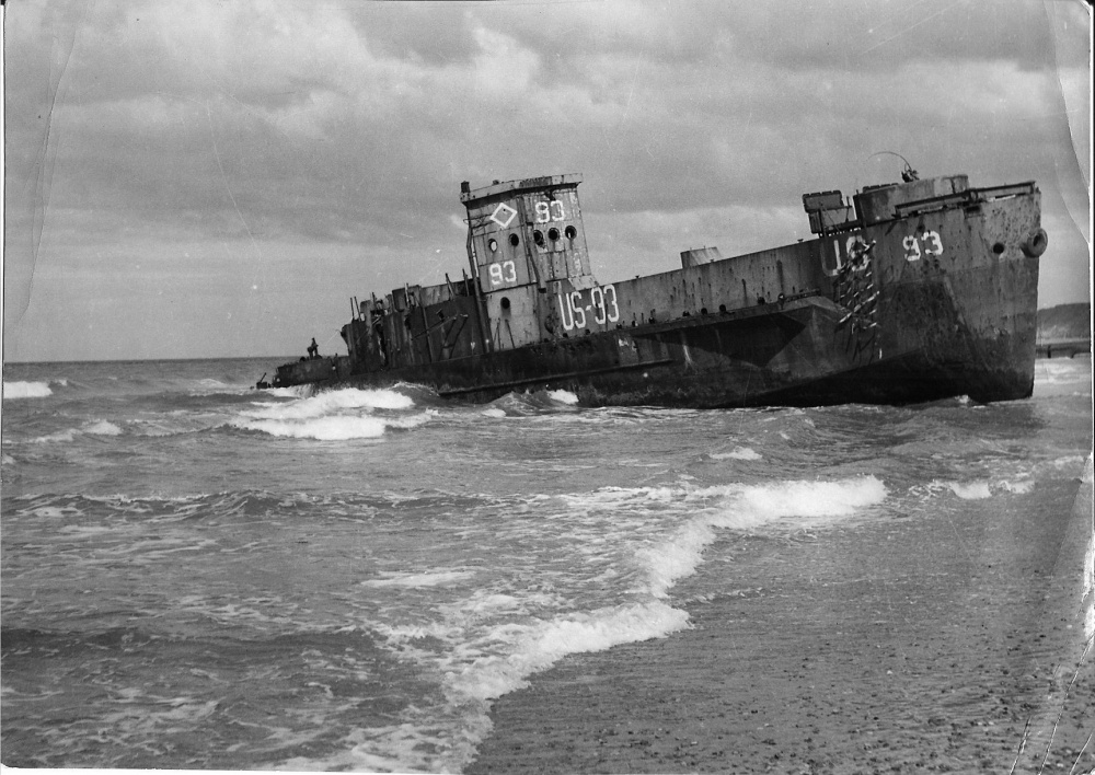 LCI-93 sits stripped and abandoned aground on Omaha Beach well after the D-Day landings. (navsource.org)